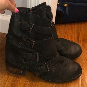 Leather combat boots with buttons on the front